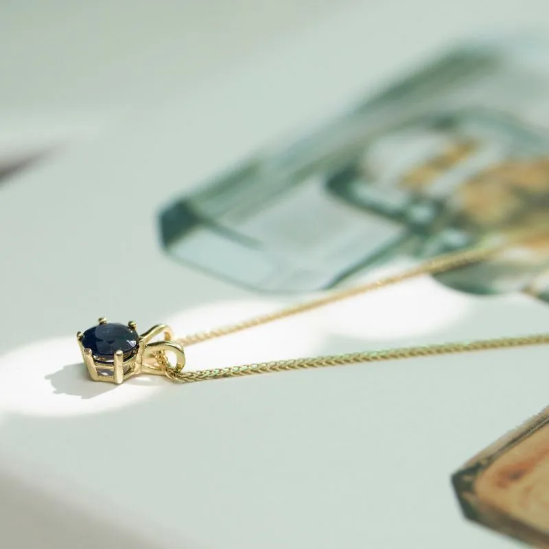 A 14 -Carat Gold Jessica Pendant In a 6mm Sapir Stone Inlay